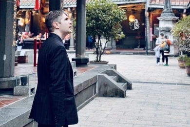 Tristan Brown strolls through a plaza at the Dalongdong Bao'an Temple in Taipei, Taiwan.